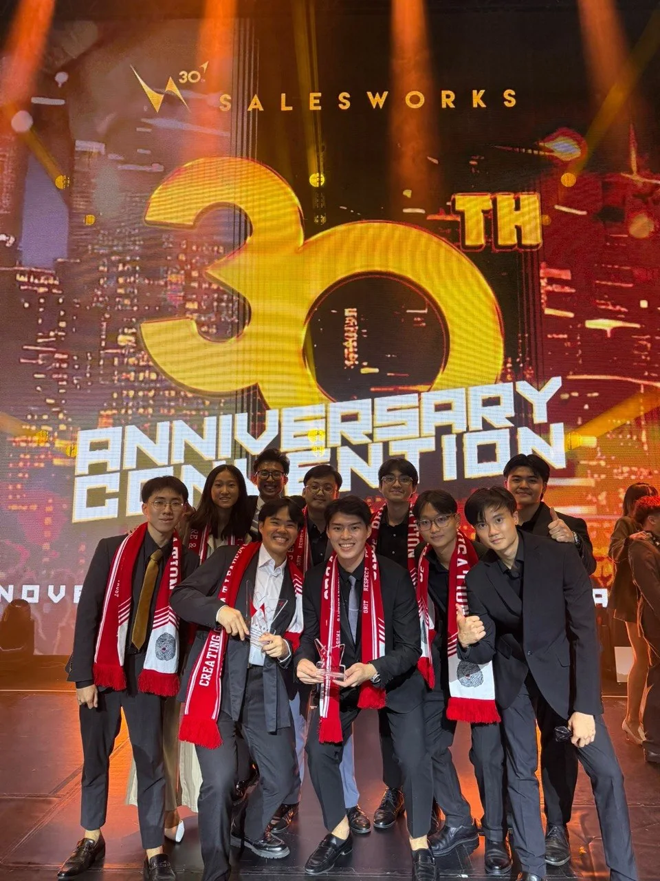 Dayone team celebrating on stage